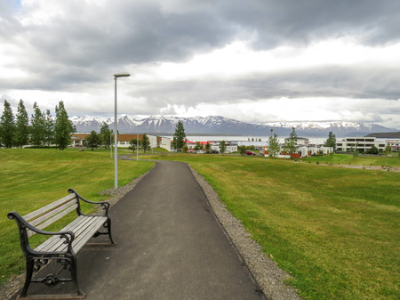 Walkway towards the harbor and fjord in small Dalvik village, northern Icelandの写真素材