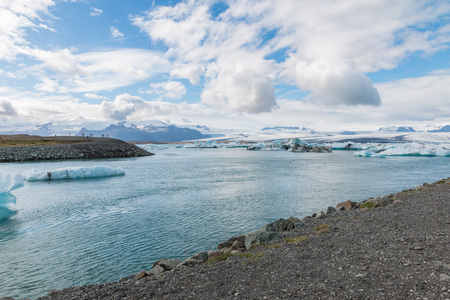 Icebergs swimming on world famous Jokulsarlon glacier lagoon in southern Iceland