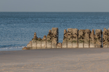 Old row of stones, built as a breakwater on the western beach of Sylt island, Germanyの写真素材