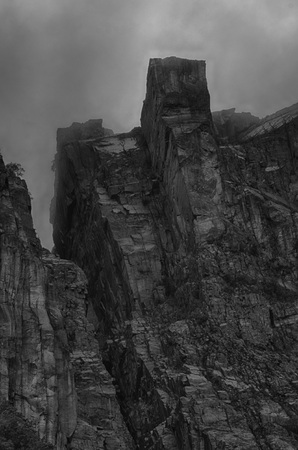 View up a giant rock face in Lysefjord, Norway, with the famous Preikestolen - or pulpit rock as seen from below, HDR versionの写真素材
