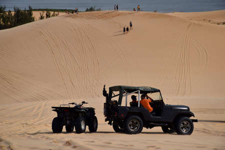 Adventure on car.sand desert with cars,Mui Ne, Vietnam.の写真素材