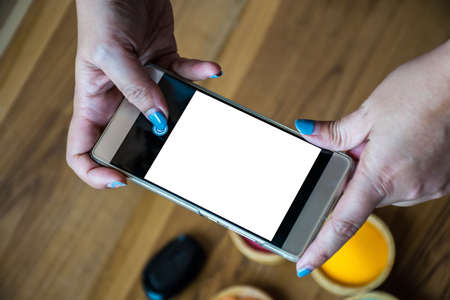 hands holding phone blank screen.の写真素材