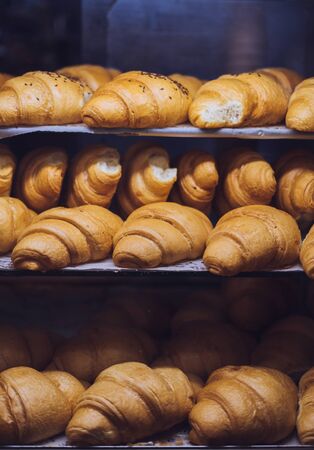 A lot of fresh homemade croissants Sold in a small bakery in town.の写真素材