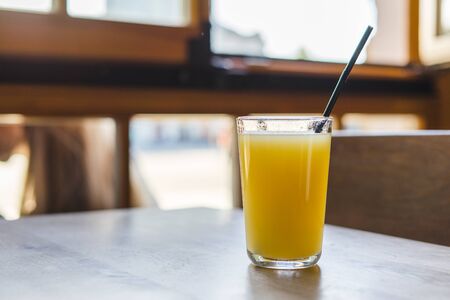 Fresh fruit juice on wooden table.
Orange juiceの写真素材