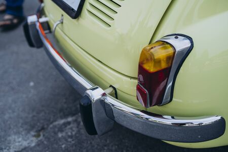 Headlight closeup. Green retro car headlight. Great Car for surfers and hippiesの写真素材