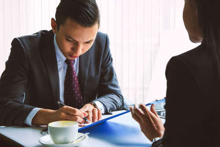 Business men and women are talking.