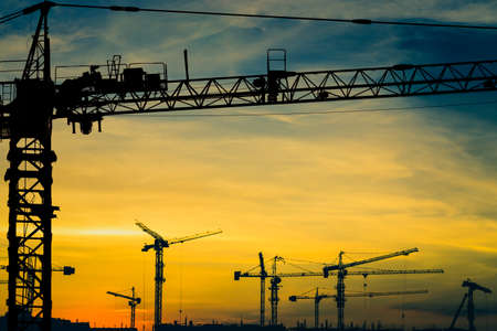 Tower cranes for construction, silhouette
