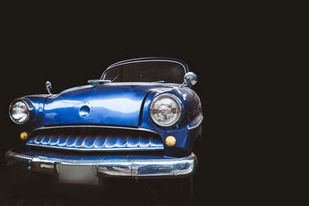 Vintage cars on a black background.の写真素材