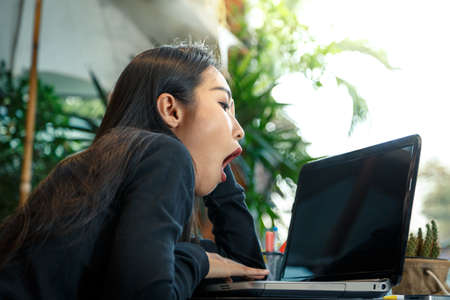 Business women are tired of work.の写真素材