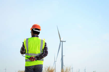 Engineers are investigating the wind turbine.