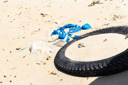Junk on the beach and the sea.