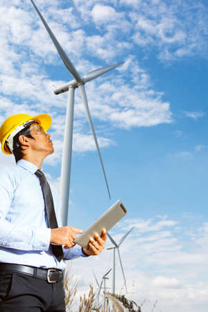 Engineers are investigating the wind turbine.の写真素材
