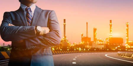 Engineers and oil refineries and evening lighting.の写真素材