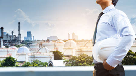 Engineers and oil refineries and evening lighting.の写真素材