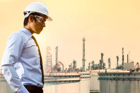 Engineers and oil refineries and evening lighting.の写真素材