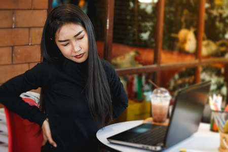 Business women are tired of work.の写真素材