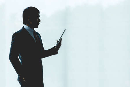 Businessman is using a tablet working in the office.の写真素材
