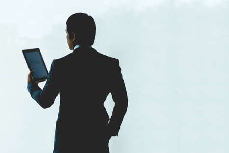 Businessman is using a tablet working in the office.