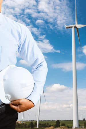 Engineers are investigating the wind turbine.の写真素材