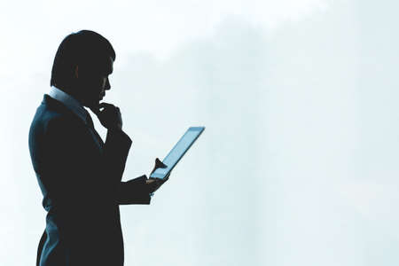 Businessman is using a tablet working in the office.の写真素材