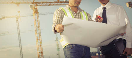 Engineers are working at building sites.の写真素材