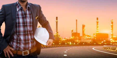 Engineers and oil refineries and evening lighting.の写真素材