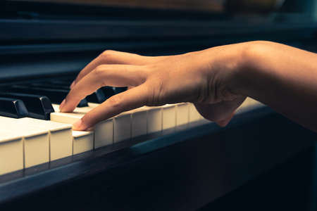 A pianist is playing piano.の写真素材