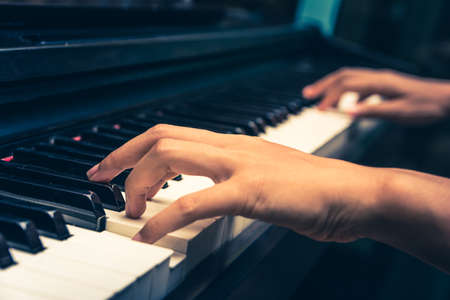 A pianist is playing piano.の写真素材