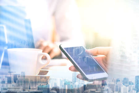 Business women are using a tablet and are using the phone.の写真素材