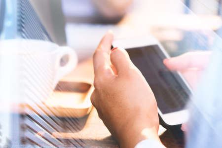 A business woman is working and using the phone.の写真素材