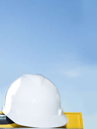 Equipment technician and construction site and sky.の写真素材