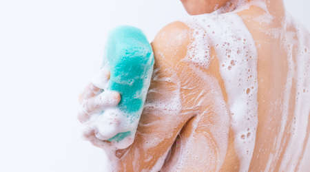 A woman is taking a shower.の写真素材