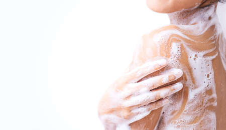 A woman is taking a shower.の写真素材