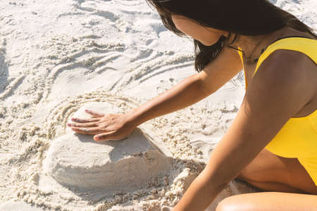 A wonen is enjoying at the beach.の写真素材