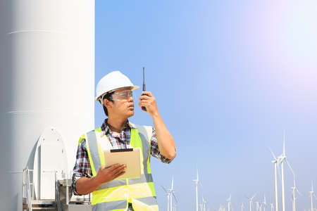 Engineers are investigating the wind turbine.の写真素材