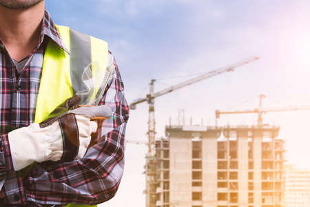 A male engineer is working at a construction site.