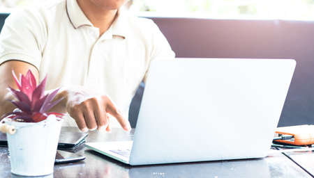 Young business people are using the notebook to work.の写真素材