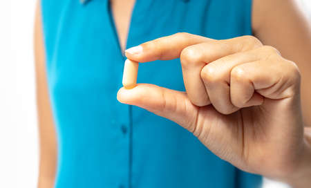 The hand that holds the vitamins for health.の写真素材