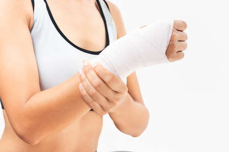 Tendon pain at the wrist of a woman from exercise.の写真素材