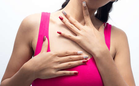 Women are showing red nails.