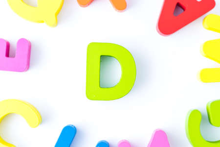 D letters in English made from wood bright colors.の写真素材