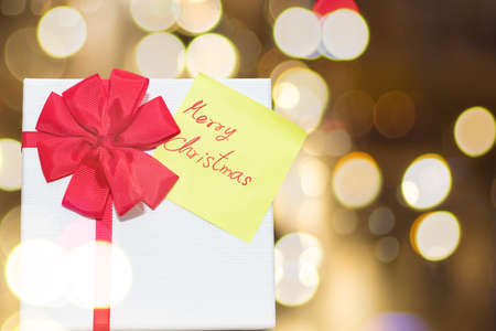 Gift Box and Christmas Cards on Bokes Background.の写真素材