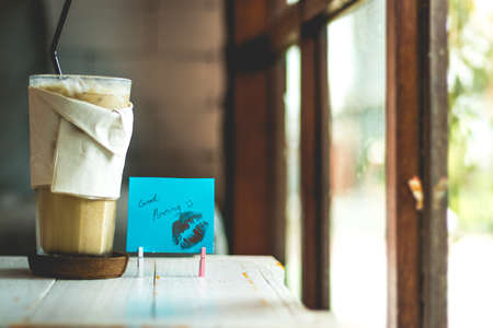 coffee and paper note with good morning.