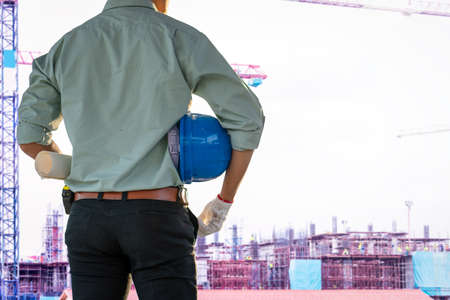 Engineers are checking the structure of the building in the construction site.