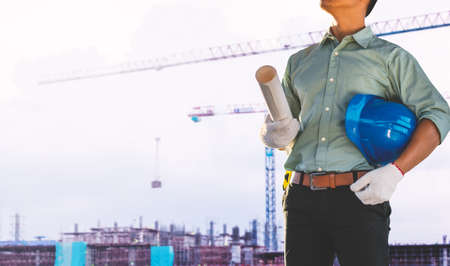 Engineers are checking the structure of the building in the construction site.の写真素材