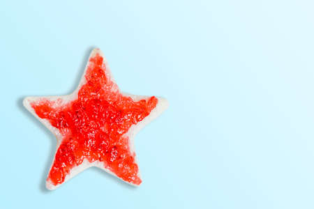 Bread cut into star shape, made with strawberry jam.の写真素材