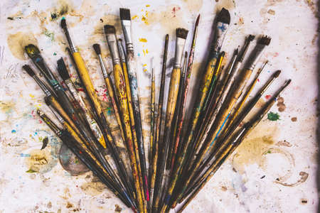 Many brushes that are stained from art