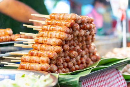 Many grilled sausages on food streets in Thailandの写真素材