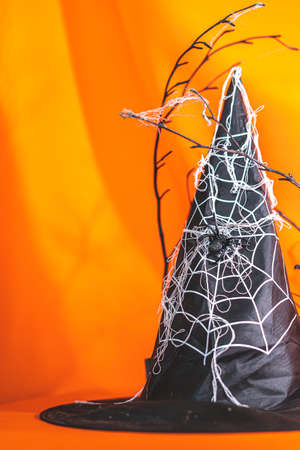 Witch's hats and house decorations during the Halloween season.
