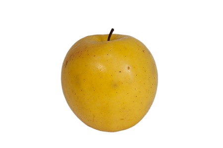 Yellow apple on white background close-upの写真素材
